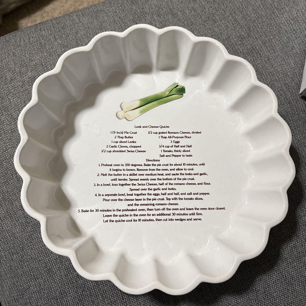 This is a vintage white ceramic quiche or flan baking dish